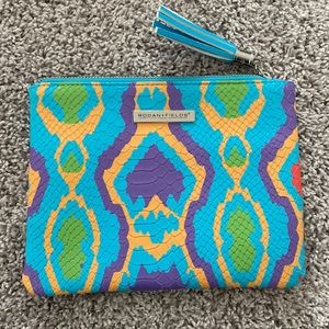 Rodan + Fields snakeskin clutch